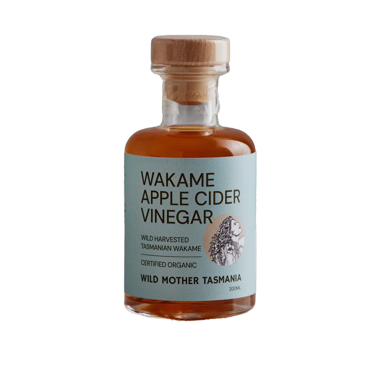 Bottle of Wakame Apple Cider Vinegar with a wooden cap on a white background