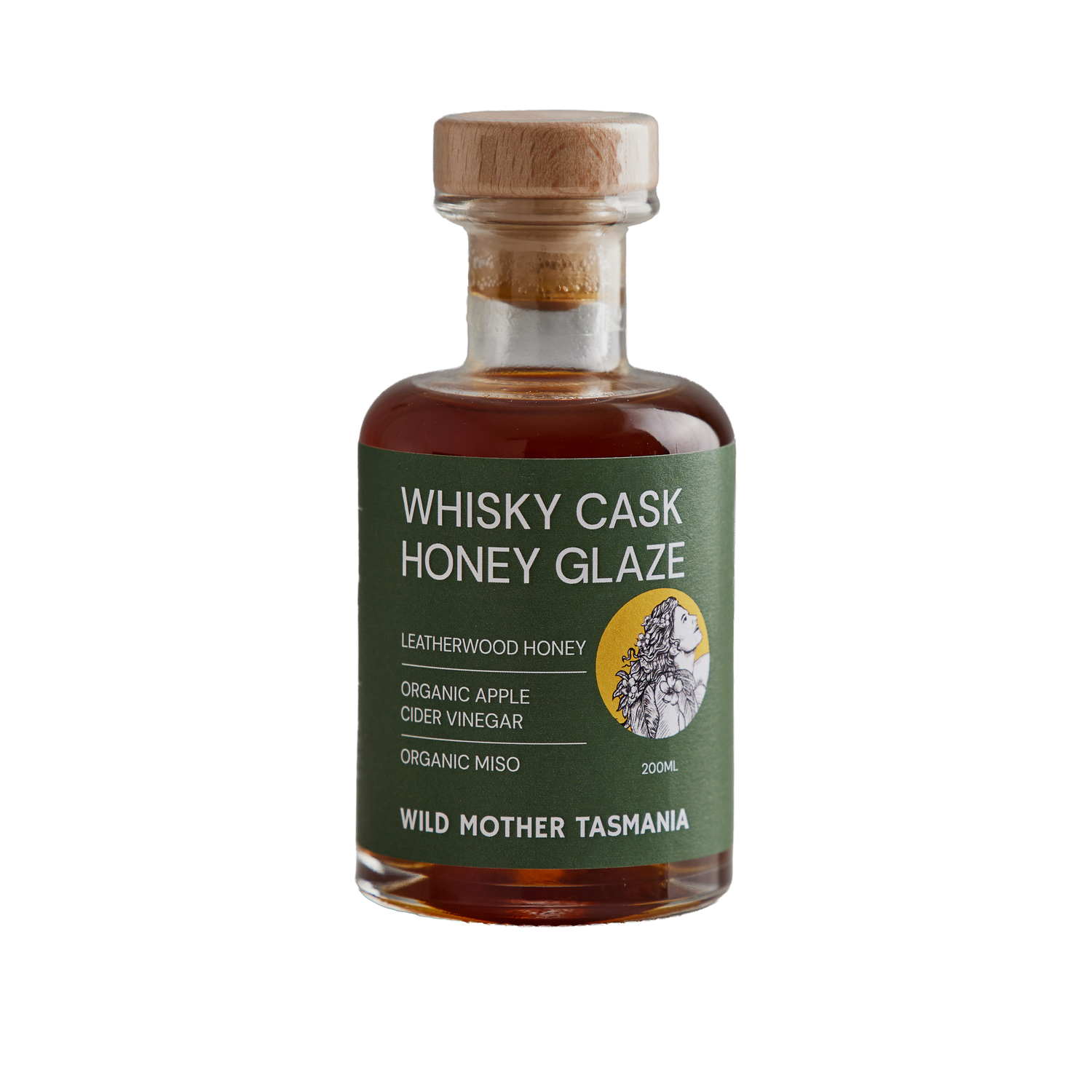Bottle of Whisky Cask Honey Glaze with a green label on a white background